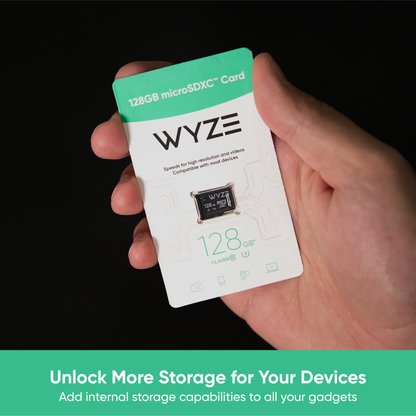 Hand holding a packaged Wyze 128GB microSD. Text that says "Unlock More Storage for Your Devices."