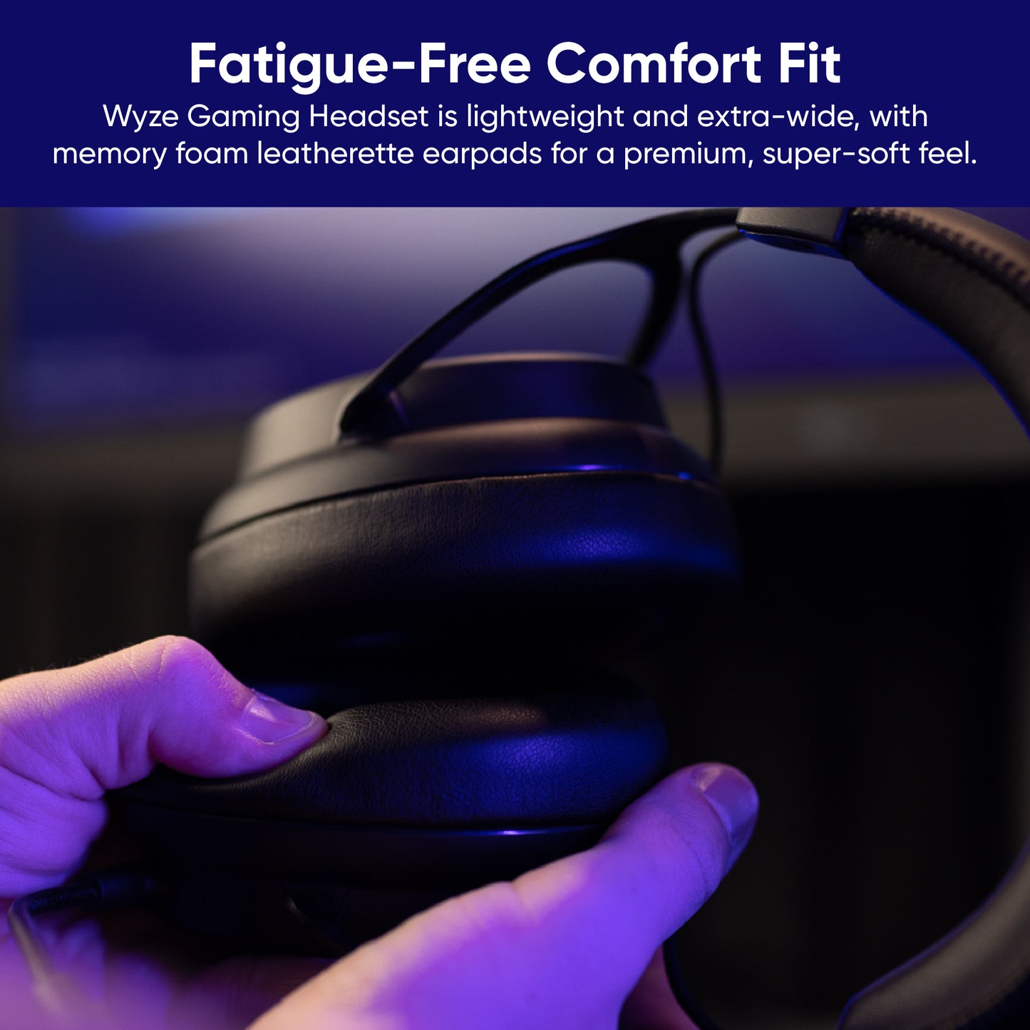 Person holding gaming headset, touching earpads. Text overlay says, "Fatigue free comfort fit, lightweight and extra wide with memory foam leatherette earpads for a premium super soft feel."