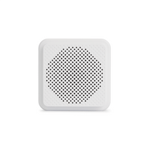 Wyze Chime - A white round speaker with a hole in the middle.