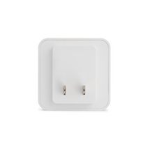 A white chime box with a silver plug.