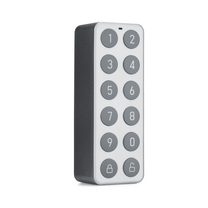 A gray and white keypad for a lock.