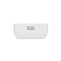 A white keypad with a green background, designed for remote disarming of home security systems.